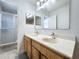 Bathroom boasts a double sink vanity, shower, and large mirror for added convenience at 10409 Laxton St, Orlando, FL 32824