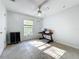 Well-lit bedroom featuring tile floors, a window with blinds, and simple furnishings at 10409 Laxton St, Orlando, FL 32824