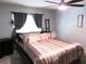 Comfortable bedroom with neutral tones, window, and a sleek ladder at 10409 Laxton St, Orlando, FL 32824