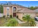 Stunning two-story home featuring a well-manicured front yard and an attached garage at 10409 Laxton St, Orlando, FL 32824