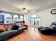 This living room is equipped with sleek wood floors, a couch, and arches at 10409 Laxton St, Orlando, FL 32824