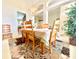 Elegant dining area featuring a chandelier and a formal table setting for six at 106 Southern Pine Way, Davenport, FL 33837