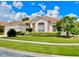 Lovely single-story home with well-maintained landscaping and a two-car garage, under a sunny sky at 106 Southern Pine Way, Davenport, FL 33837