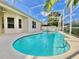 Sparkling pool surrounded by a screen enclosure, a patio, and beautiful landscaping at 106 Southern Pine Way, Davenport, FL 33837