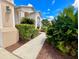 Inviting walkway leading to the home, bordered by mature landscaping and lush greenery at 106 Southern Pine Way, Davenport, FL 33837