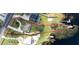 Aerial view of property boundaries, house, dock, waterfront access, and surrounding neighborhood at 10919 Lakeshore Dr, Clermont, FL 34711