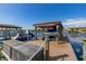 View of boat dock featuring boats, boat lifts, and jet skis at 10919 Lakeshore Dr, Clermont, FL 34711