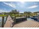 Dockside view of the lake featuring personal watercraft on a sunny day at 10919 Lakeshore Dr, Clermont, FL 34711