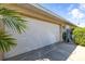 Attached two-car garage with a white door, showcasing the home's practical storage and parking solutions at 10919 Lakeshore Dr, Clermont, FL 34711