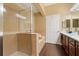 Bright bathroom featuring tiled walk-in shower and separate tub at 1221 Olmstead Blvd # 214, Celebration, FL 34747