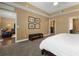 Open main bedroom view to living area, en-suite bath and walk-in closet at 1221 Olmstead Blvd # 214, Celebration, FL 34747