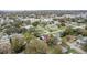 Aerial view of the property in a quiet, residential neighborhood filled with trees at 1506 Maryland Ave, St Cloud, FL 34769