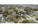 Aerial view of a home with a long driveway in a neighborhood with tall trees at 1506 Maryland Ave, St Cloud, FL 34769