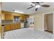 Traditional-style kitchen with wood cabinets, stainless steel appliances, and tile flooring at 1506 Maryland Ave, St Cloud, FL 34769