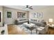 Bright living room featuring a comfortable gray sectional, decorative rug, and a large window at 1506 Maryland Ave, St Cloud, FL 34769