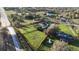 Aerial view of the property surrounded by a red boundary, showcasing the landscaping at 15350 Arabian Way, Montverde, FL 34756