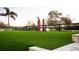 Expansive backyard showcasing lush green grass, framed by a dark wooden fence at 15350 Arabian Way, Montverde, FL 34756