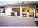 Outdoor carport with covered grilling station, including an exercise station and a black metal sliding door at 15350 Arabian Way, Montverde, FL 34756