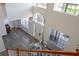 Elevated view of the foyer featuring large windows, high ceilings, and a clear view of the dining room at 15350 Arabian Way, Montverde, FL 34756