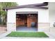 Open garage with epoxy flooring, storage shelving, and work space at 15350 Arabian Way, Montverde, FL 34756