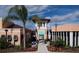 Exterior of resort clubhouse entrance with a tower and pedestrian walkway at 1696 Tropical Palms Cir, Kissimmee, FL 34747