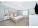 Serene main bedroom featuring a tray ceiling, plush carpet, and neutral color palette at 1696 Tropical Palms Cir, Kissimmee, FL 34747