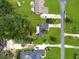 An aerial view showcases the property's location and the neighborhood's layout with lush green lawns at 1710 Big Oak Ln, Kissimmee, FL 34746