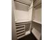 Custom closet features shelving, drawers and rods for ample storage and organization at 1894 Valley Forge Dr, St Cloud, FL 34769