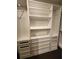Custom closet features multiple shelves, drawers and rods to maximize storage and organization at 1894 Valley Forge Dr, St Cloud, FL 34769