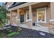 Inviting front porch with stone pillars and landscaping, perfect for relaxing at 1894 Valley Forge Dr, St Cloud, FL 34769