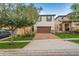 Charming two-story home with a brick driveway, a two-car garage, and manicured front yard landscaping at 1909 Nice Ct, Kissimmee, FL 34747