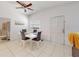 Bright dining room with modern table and chairs, tile floors, and simple decor at 1921 N Forsyth Rd, Orlando, FL 32807