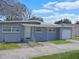 Charming single-story home with a classic facade and an attached garage at 1921 N Forsyth Rd, Orlando, FL 32807