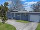 Street view of single-story home featuring a well-maintained lawn and a quaint, welcoming entrance at 1921 N Forsyth Rd, Orlando, FL 32807