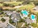 Stunning aerial view showcasing the resort-style pool, clubhouse, golf course, and manicured grounds at 2108 Antilles Club Dr, Kissimmee, FL 34747