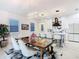 Dining area with a modern chandelier is located in the background of the kitchen at 2108 Antilles Club Dr, Kissimmee, FL 34747