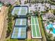 Aerial view of tennis and bocce ball courts with parking and pool area, perfect for active community living at 2108 Antilles Club Dr, Kissimmee, FL 34747