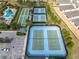 Aerial view of well-maintained community tennis courts and bocce ball with convenient parking at 2108 Antilles Club Dr, Kissimmee, FL 34747