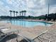 Relaxing community pool area with lounge chairs and palm trees at 2199 Bluebird Pl, St Cloud, FL 34771