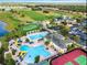 Aerial view of community featuring pool, clubhouse, golf course, and tennis courts for active living and recreation at 2292 Crofton Ave, Davenport, FL 33837