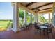 Covered outdoor dining area with tables and chairs overlooking lush greenery and scenic views at 2292 Crofton Ave, Davenport, FL 33837