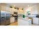 Modern kitchen with stainless steel appliances, granite countertops, and bright white cabinets at 2292 Crofton Ave, Davenport, FL 33837