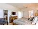 Serene main bedroom boasts a wooden dresser, a flat screen television, and calm, neutral decor at 2292 Crofton Ave, Davenport, FL 33837