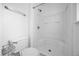 White shower stall next to a toilet, with magazine rack at 241 Cranbrook Dr, Kissimmee, FL 34758