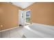 A large soaking tub sits next to a large window with tiled floors at 241 Cranbrook Dr, Kissimmee, FL 34758