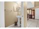 Simple powder room with a pedestal sink and neutral-colored walls at 241 Cranbrook Dr, Kissimmee, FL 34758