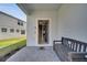 Inviting entryway with tiled floor, bench seating, and an open view to the interior of the home at 2471 Dubai St, Kissimmee, FL 34747