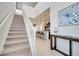 Bright foyer leading to a modern kitchen featuring pendant lighting, granite counters, and seating at the breakfast bar at 2471 Dubai St, Kissimmee, FL 34747