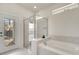 Bright bathroom featuring shower enclosure and exterior access door at 2471 Dubai St, Kissimmee, FL 34747