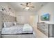 Bright and stylish main bedroom with king bed, TV, and closet at 2471 Dubai St, Kissimmee, FL 34747